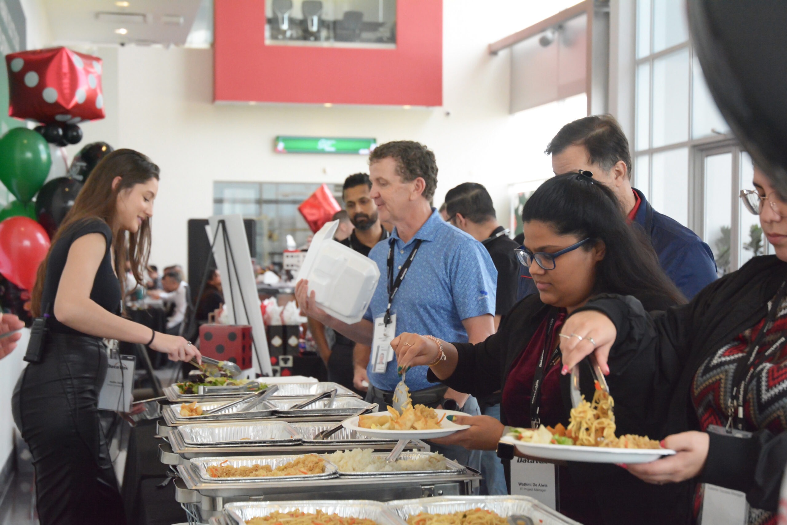People helping themselves to a variety of foods at a previous SKO event