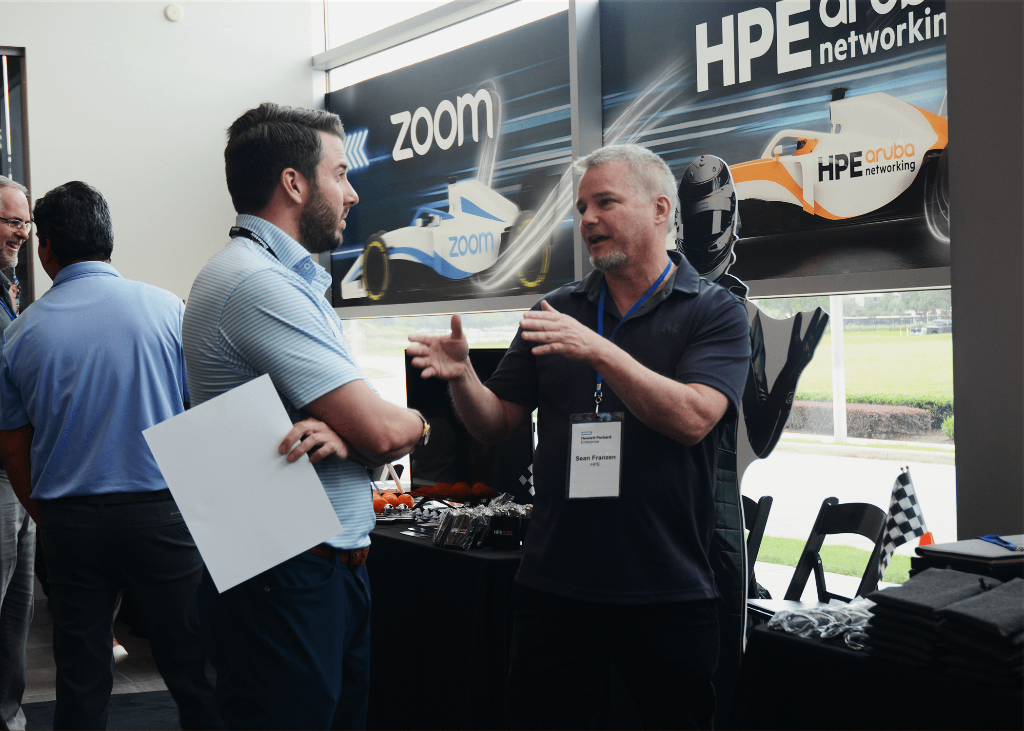 HPE Aruba representative speaking to DataVox team member.